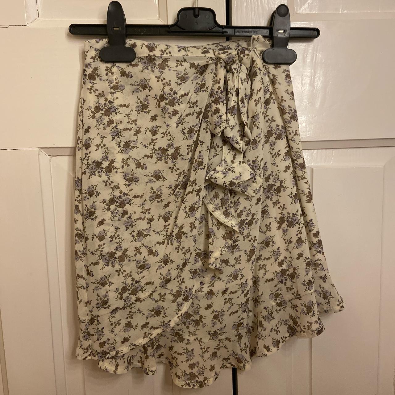 Floral wrap mini skirt. Still has tags on never... - Depop