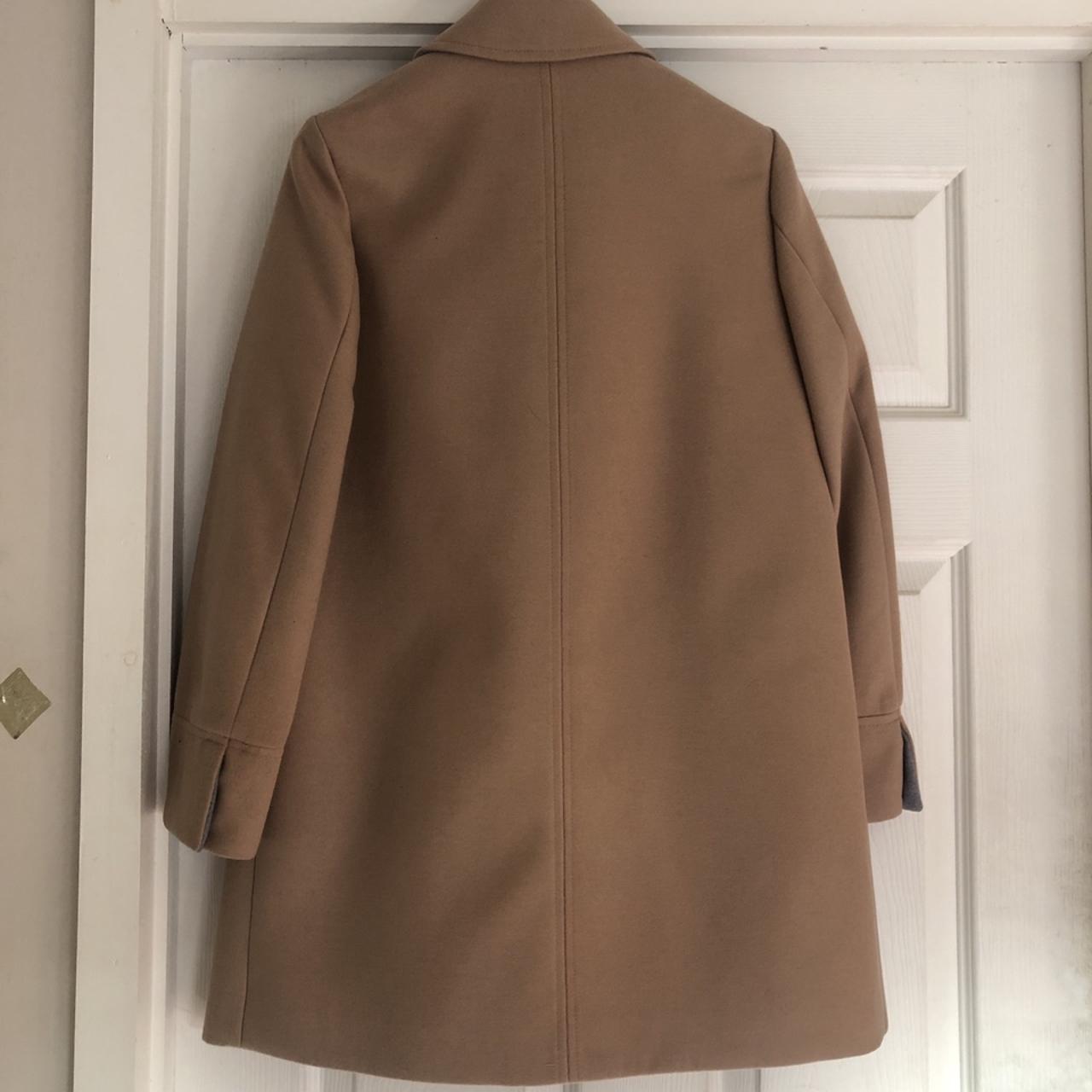 Brand new with tags. camel coat. Petite size... Depop