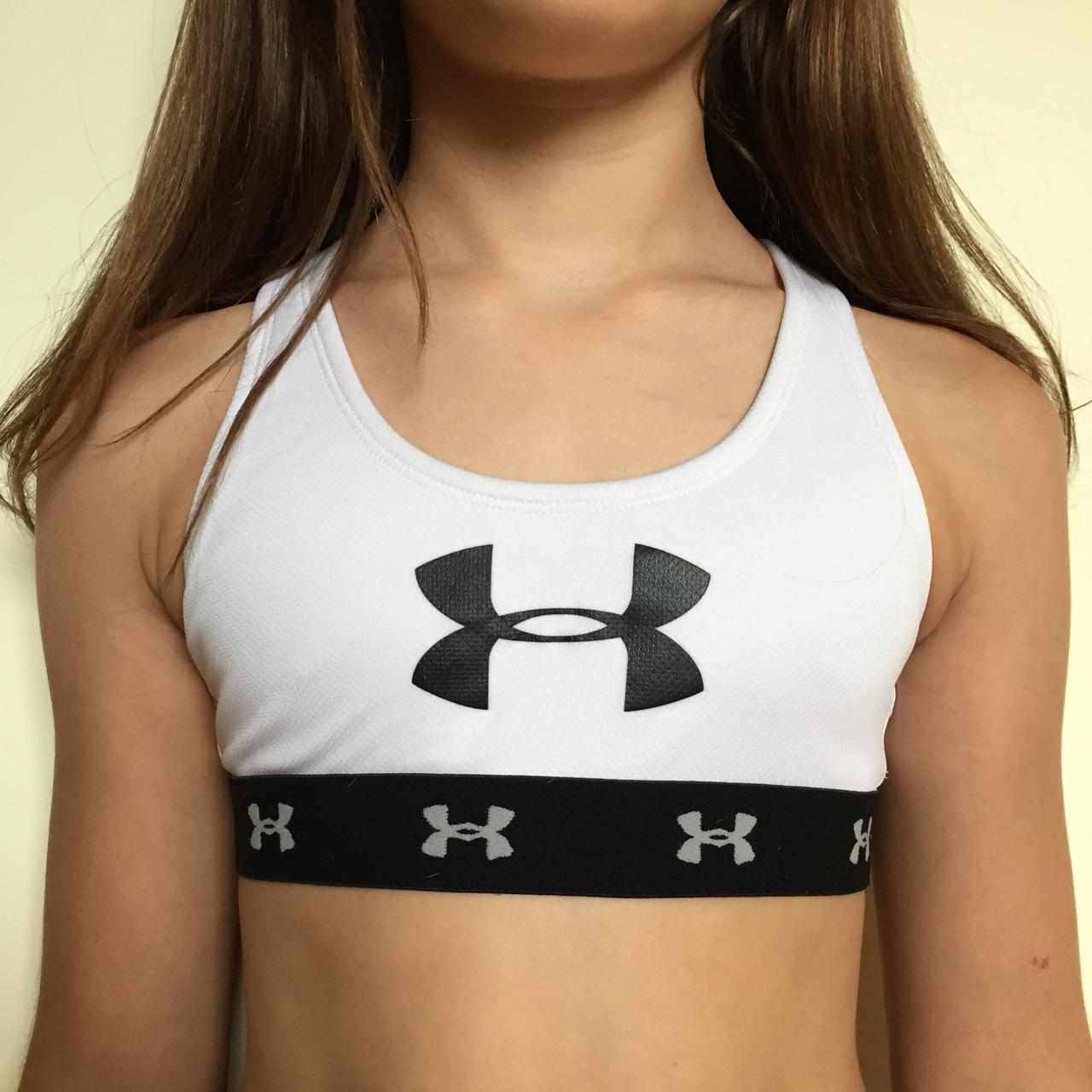 White Under Armor sports bra with black accents. - Depop