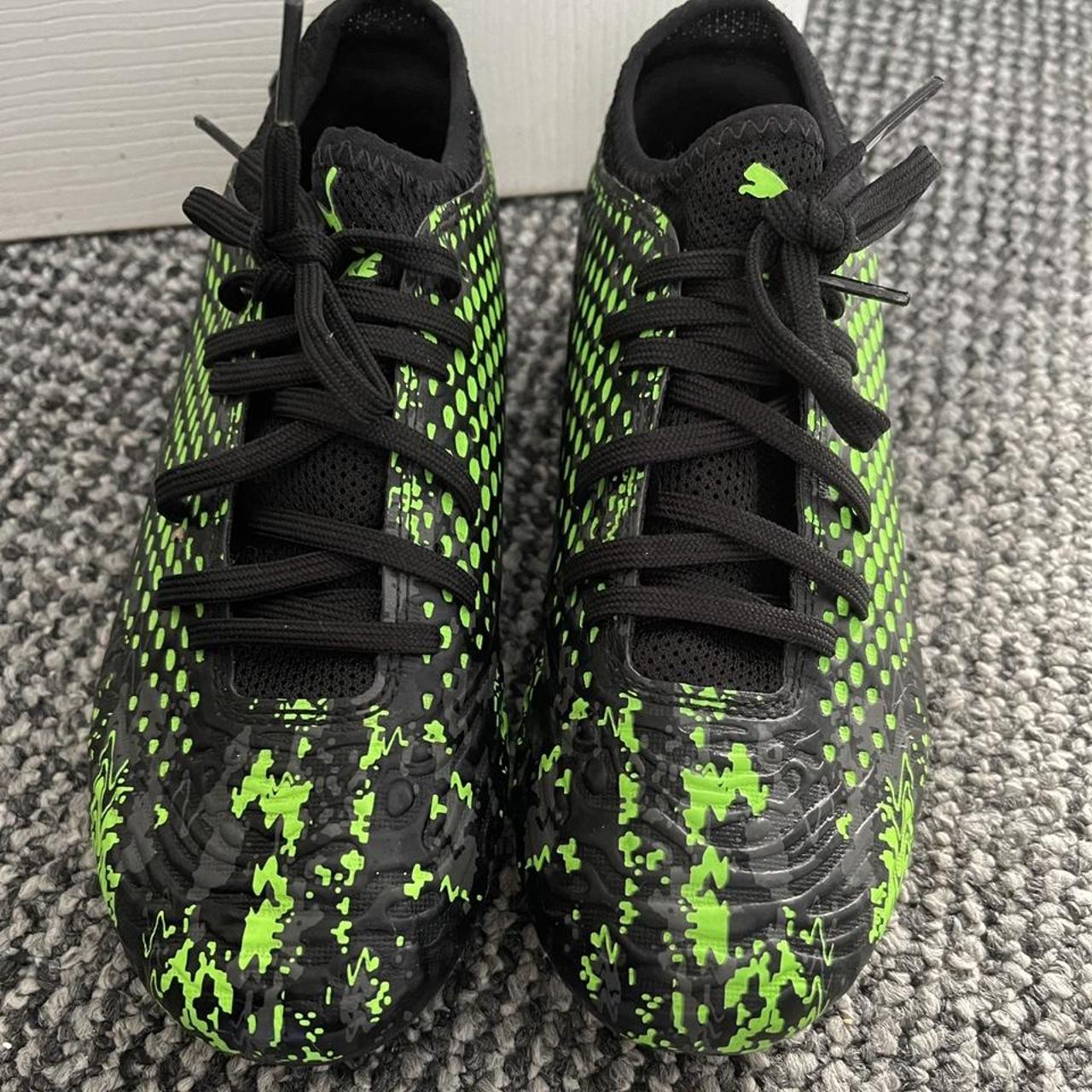 Kids puma black and bright green football boots.... Depop