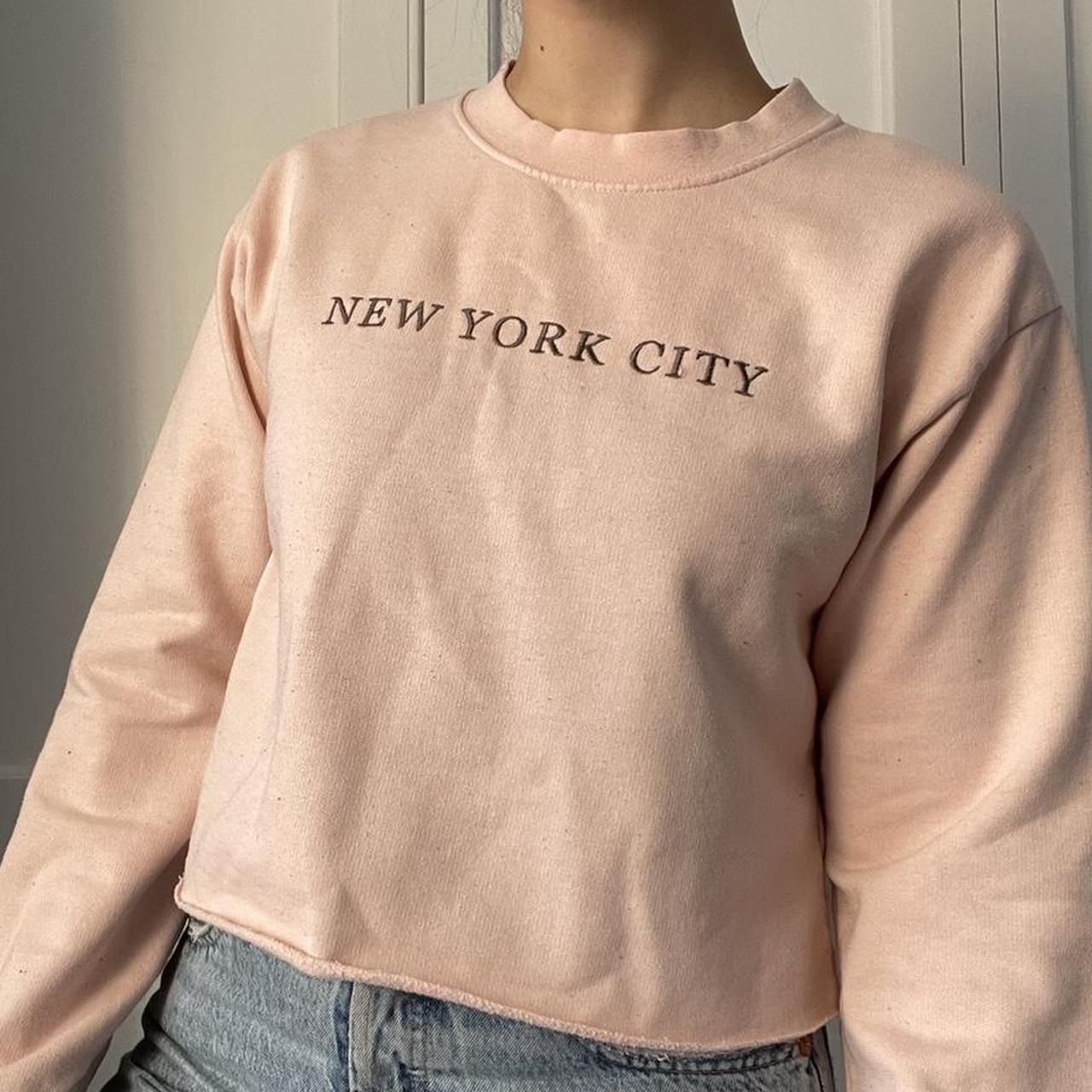 Baby pink sweatshirt with grey ‘New York City’... Depop