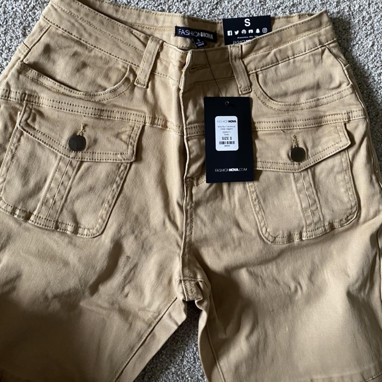 Fashion Nova khaki pants cuffed at the bottom with... Depop