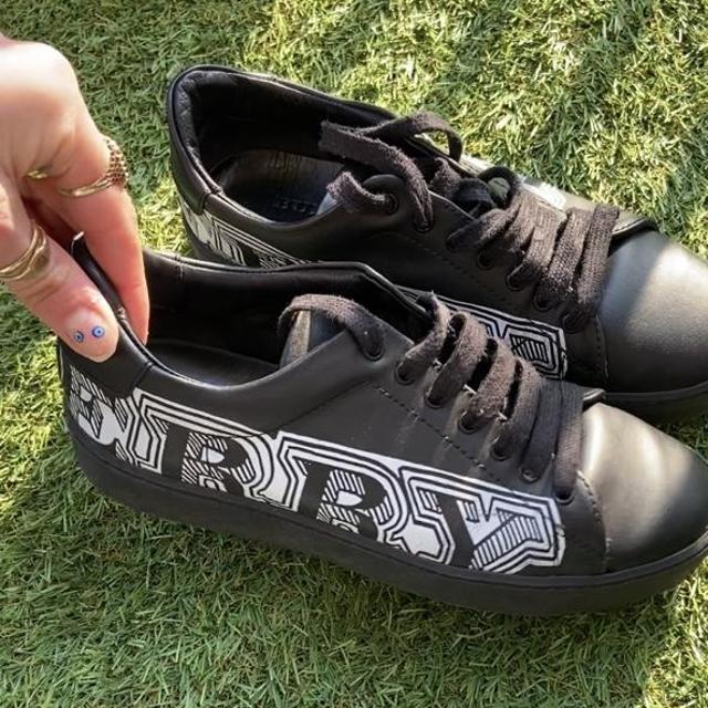 Burberry black leather trainers with white graphic. Depop