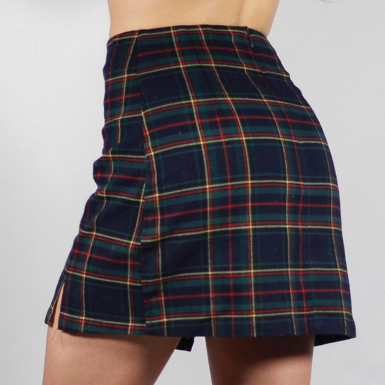 Navy multicolored plaid miniskirt, labeled One... Depop