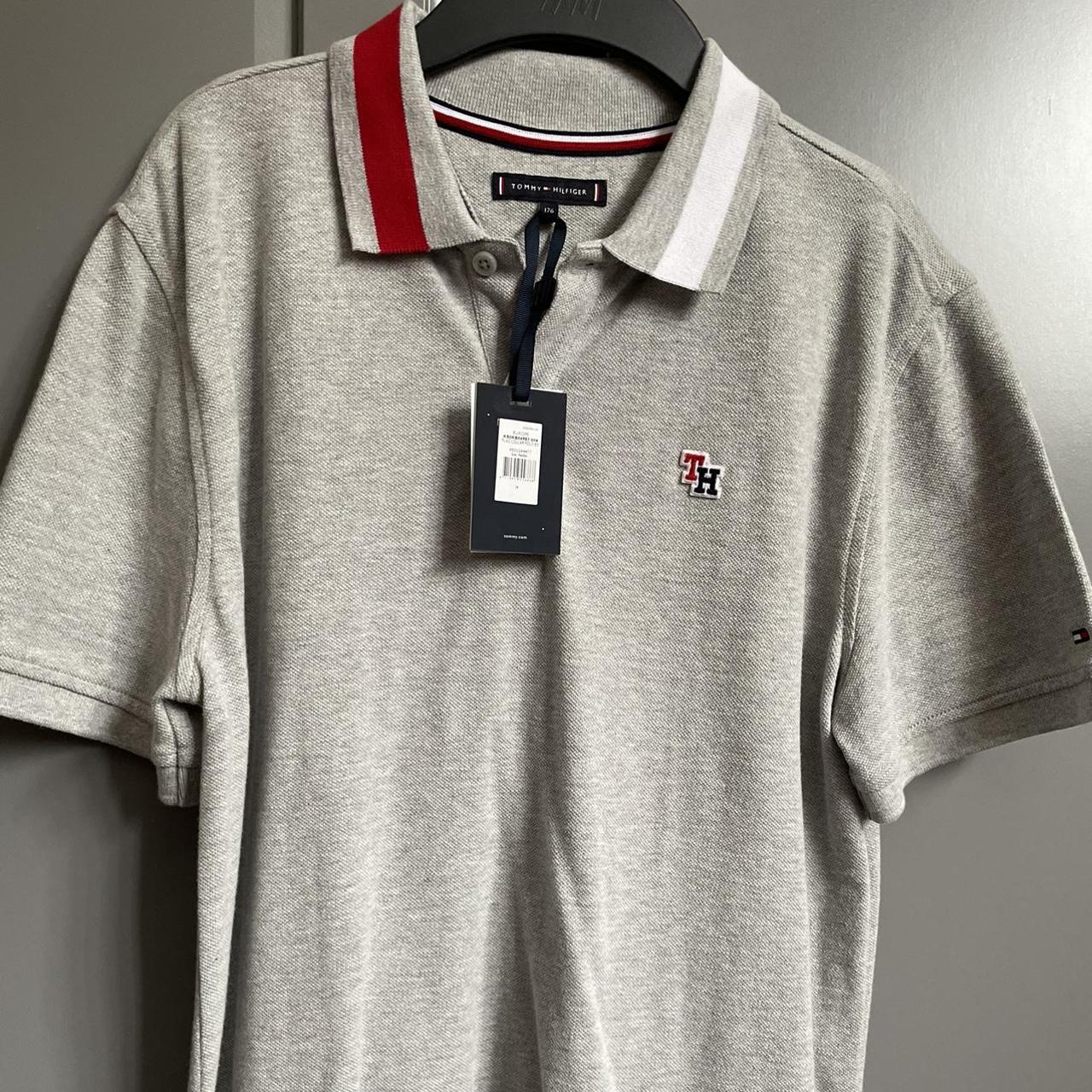 Tommy Hilfiger light grey polo shirt, never been... - Depop