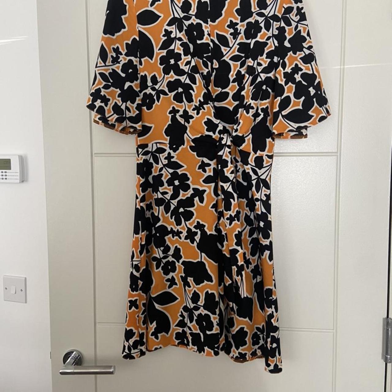 Papaya yellow and black floral dress size 10. From a... Depop