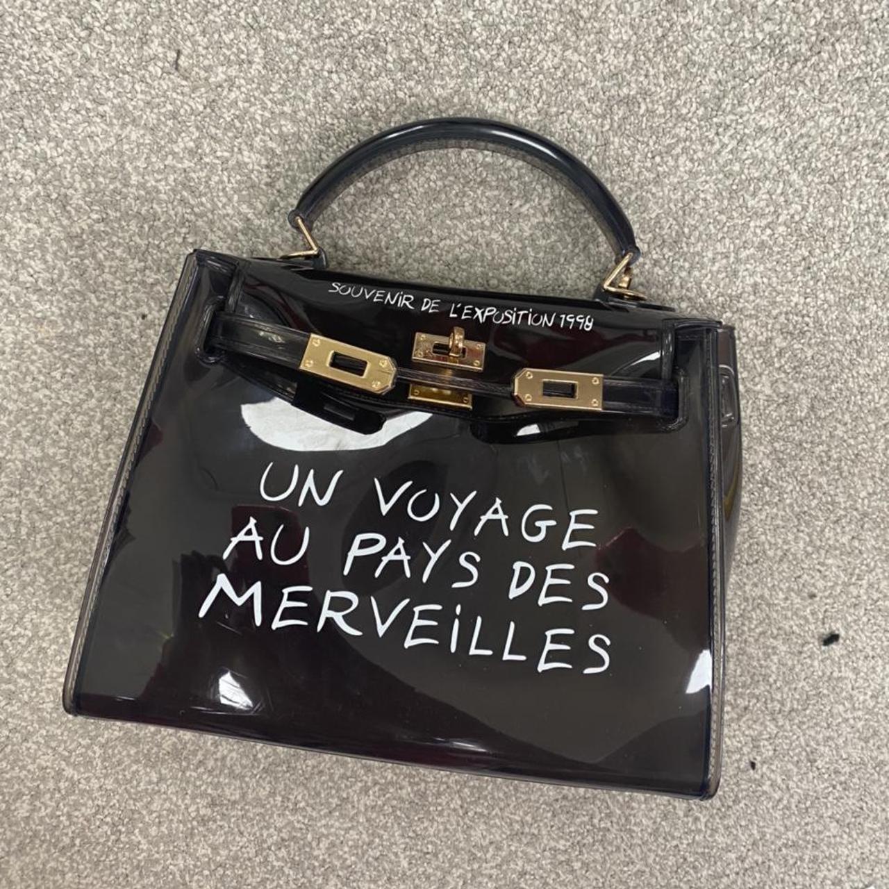 Un voyage black bag hot sale