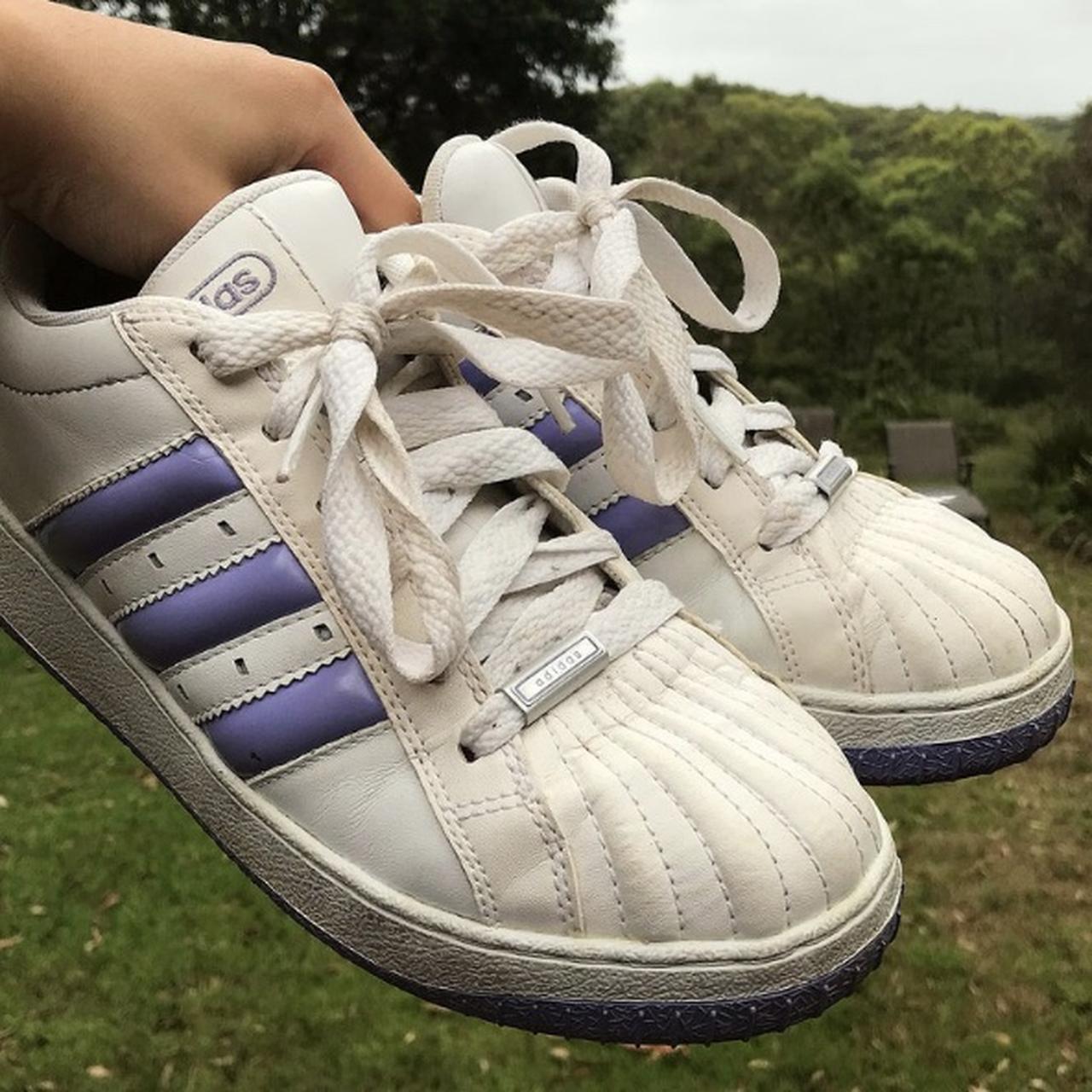 Old School shell toe Superstar Adidas tennis shoes.