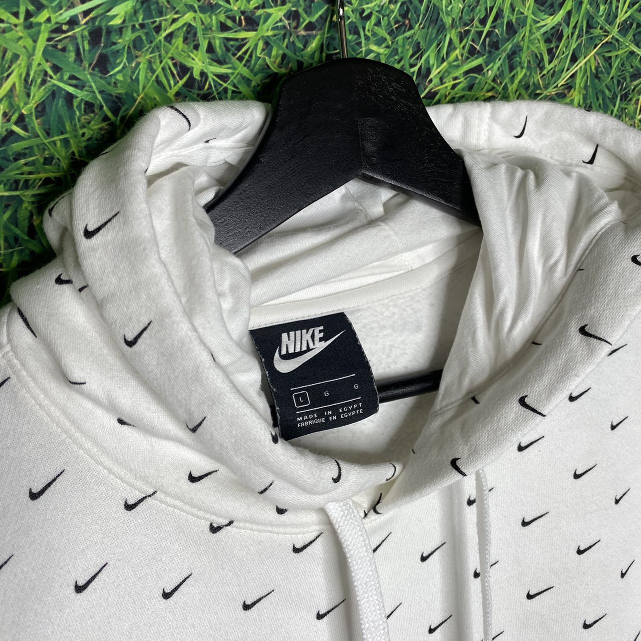 Nike all over online swoosh sweatshirt