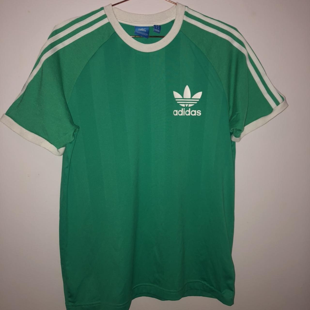 Green Adidas T-shirt with white stripes and logo//... - Depop