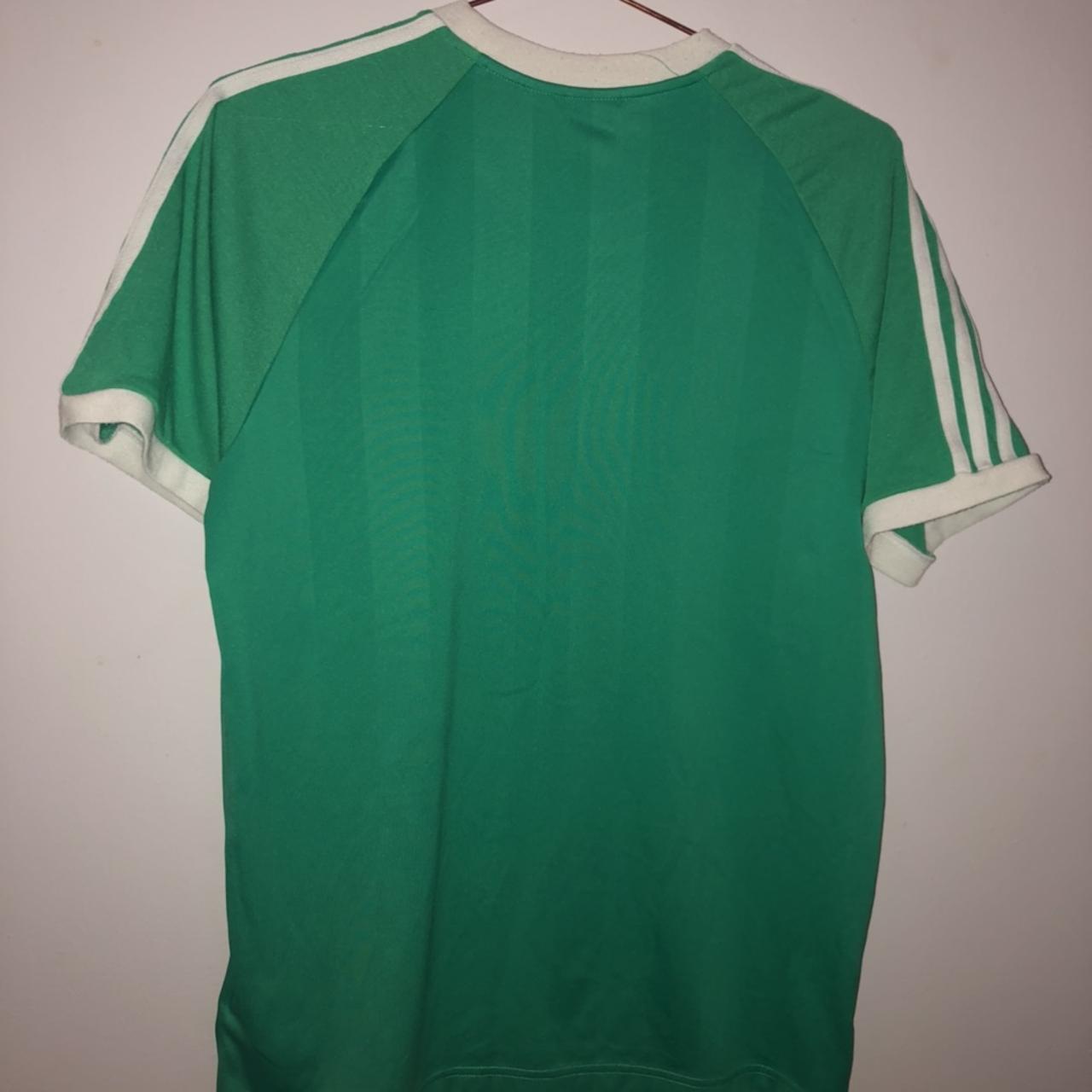 Green Adidas T-shirt with white stripes and logo//... - Depop