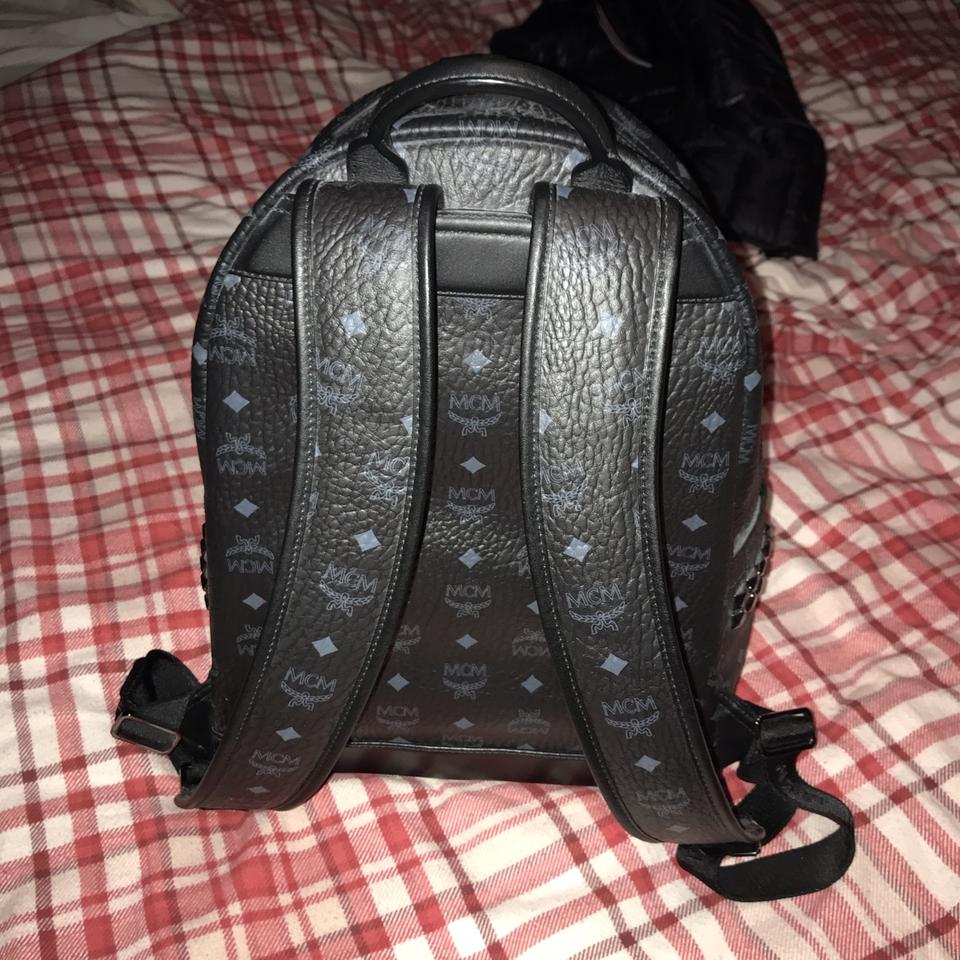 Small, pre-loved, black MCM backpack with minor wear - Depop