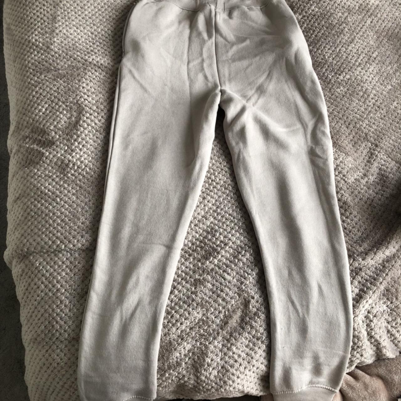 BoohooMAN slim fit tracksuit bottoms in nude/taupe.... Depop
