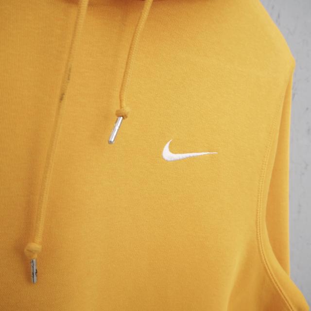 gold nike sweater