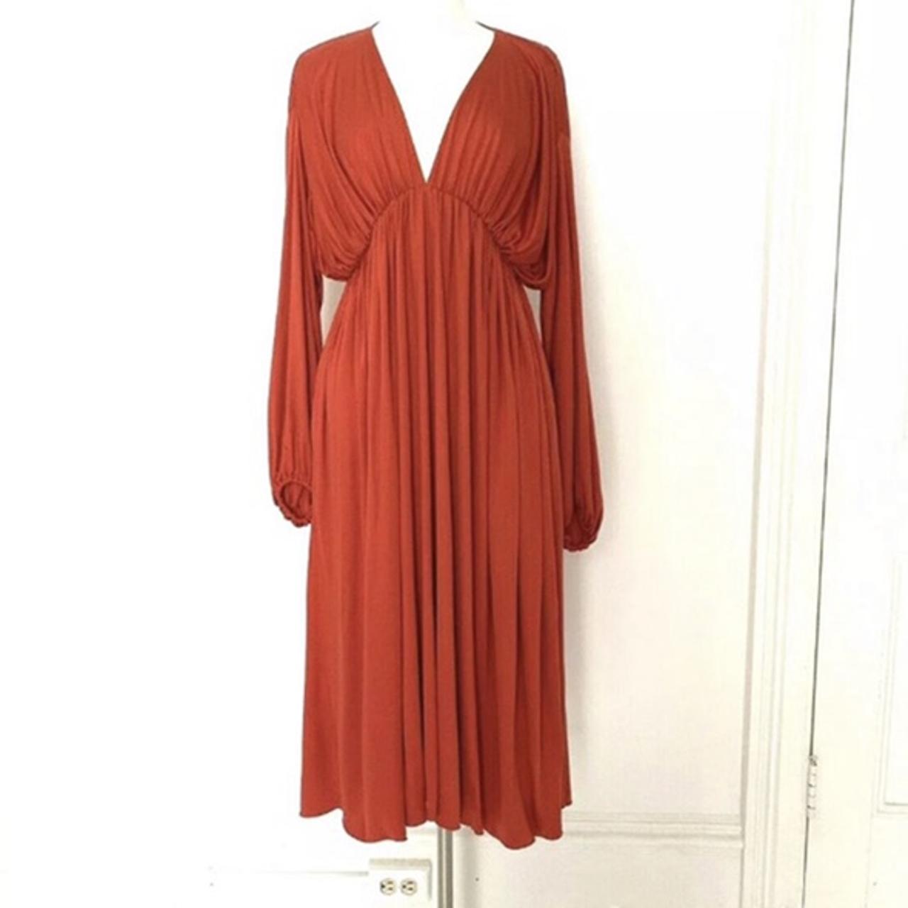 The Row Sasha dress in red. This pleated design in