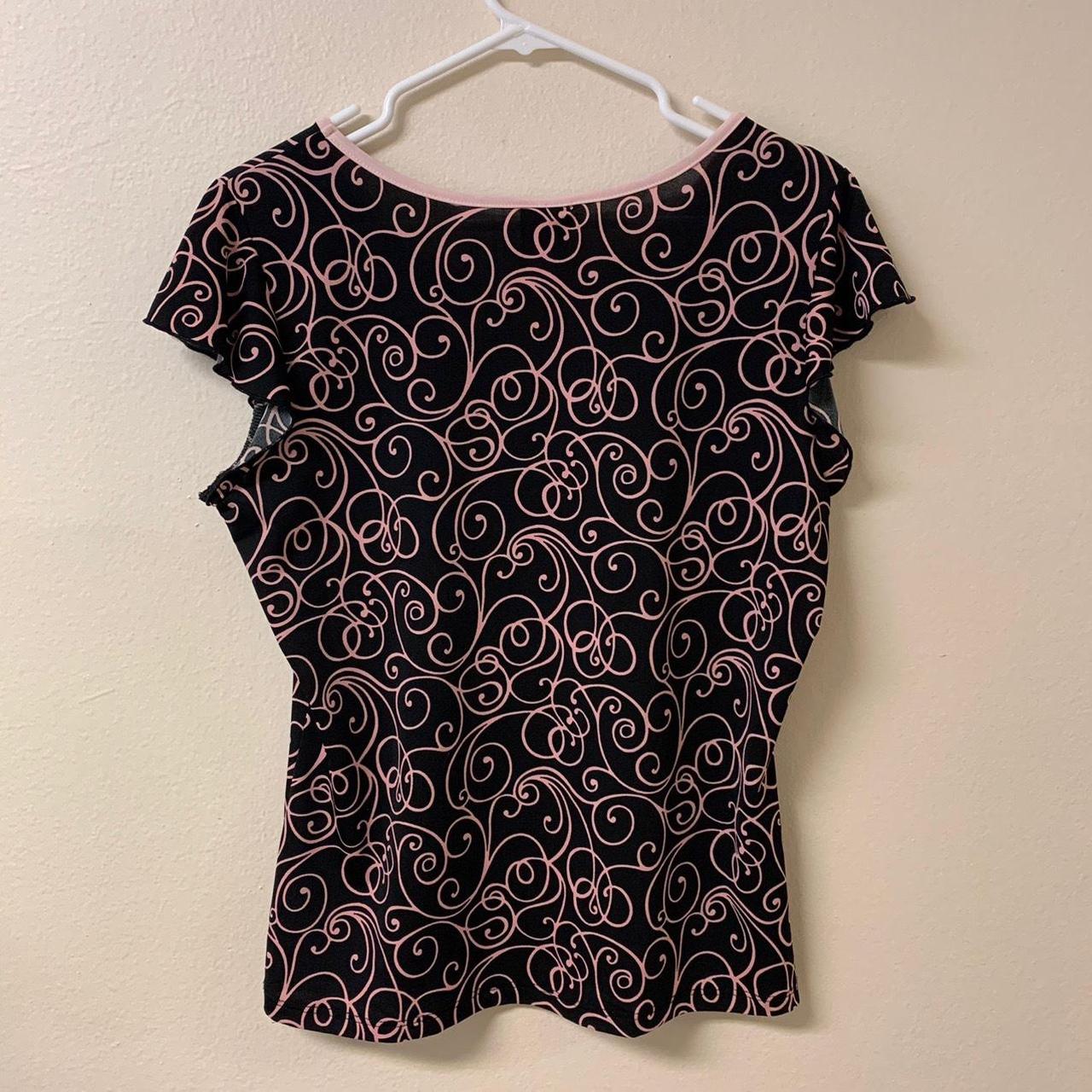 this is a black and pink spiral patterned baby tee... - Depop
