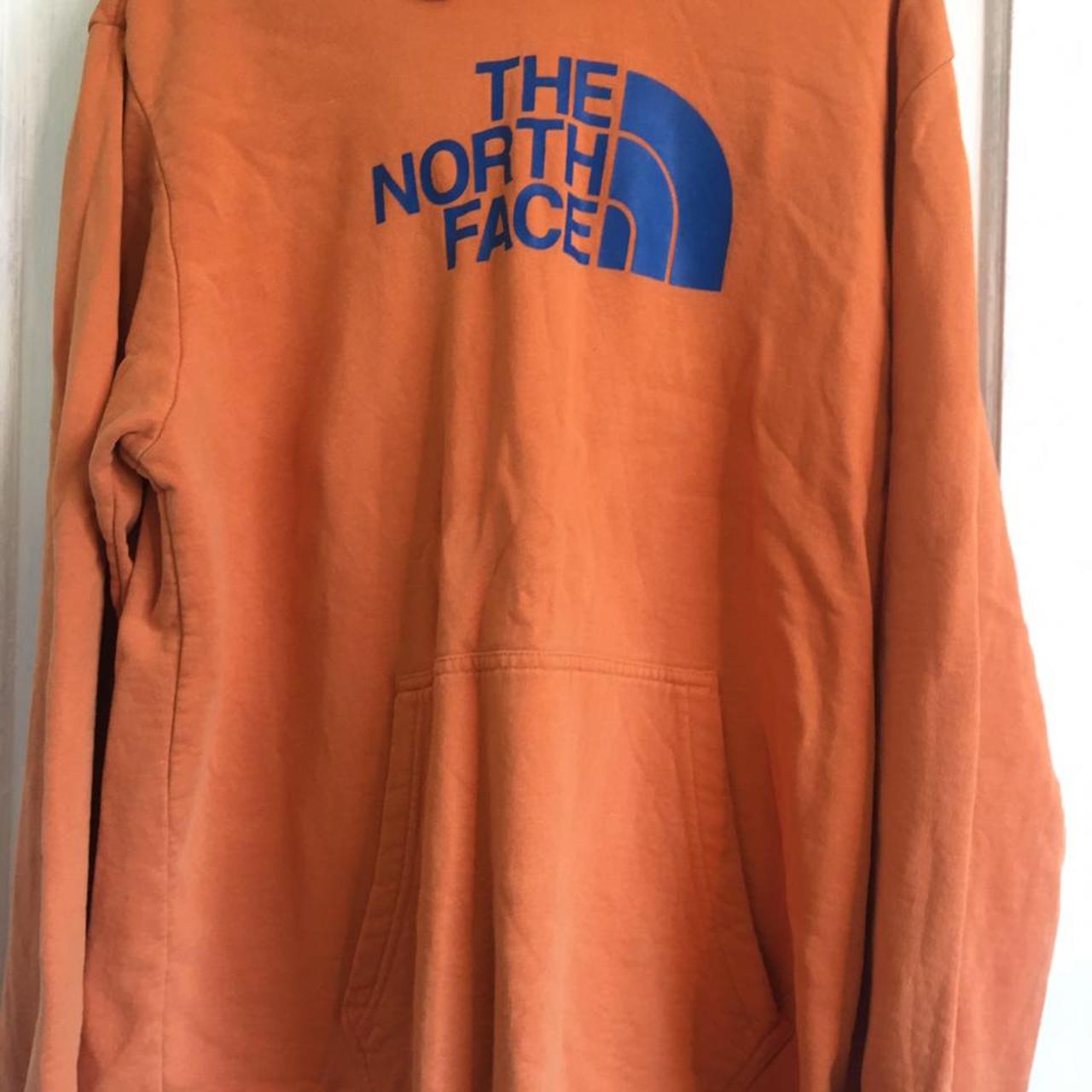 blue and orange north face hoodie