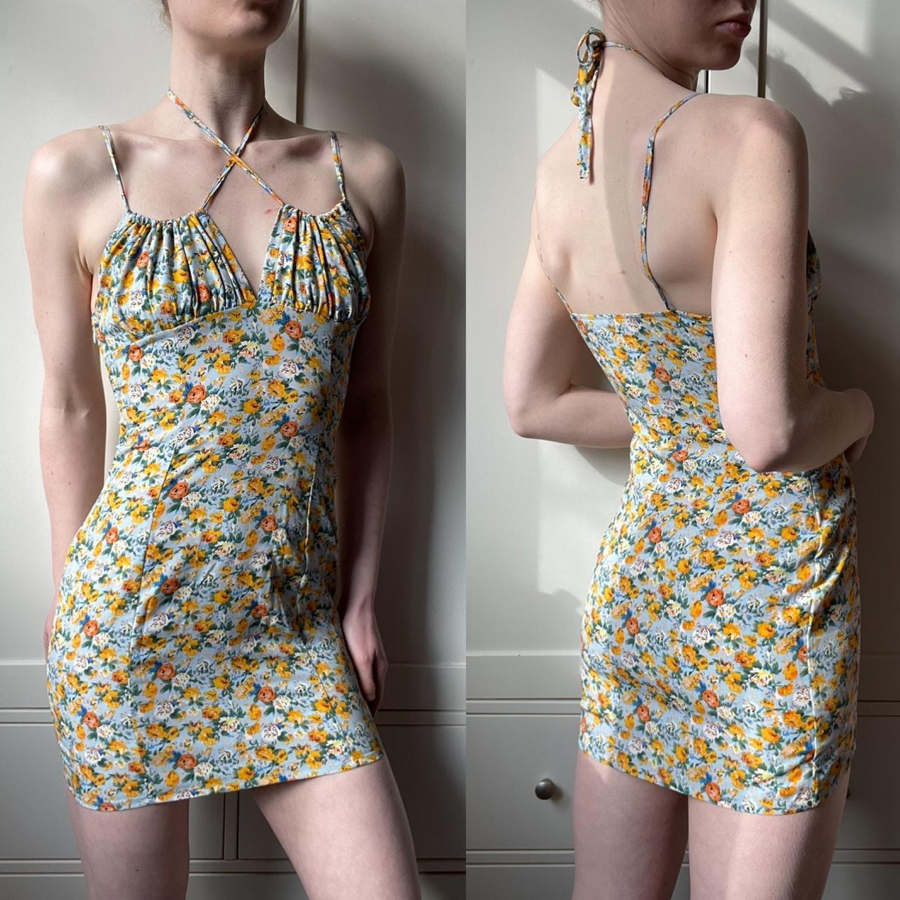 Stunning ditsy floral mini dress with halter tie... - Depop
