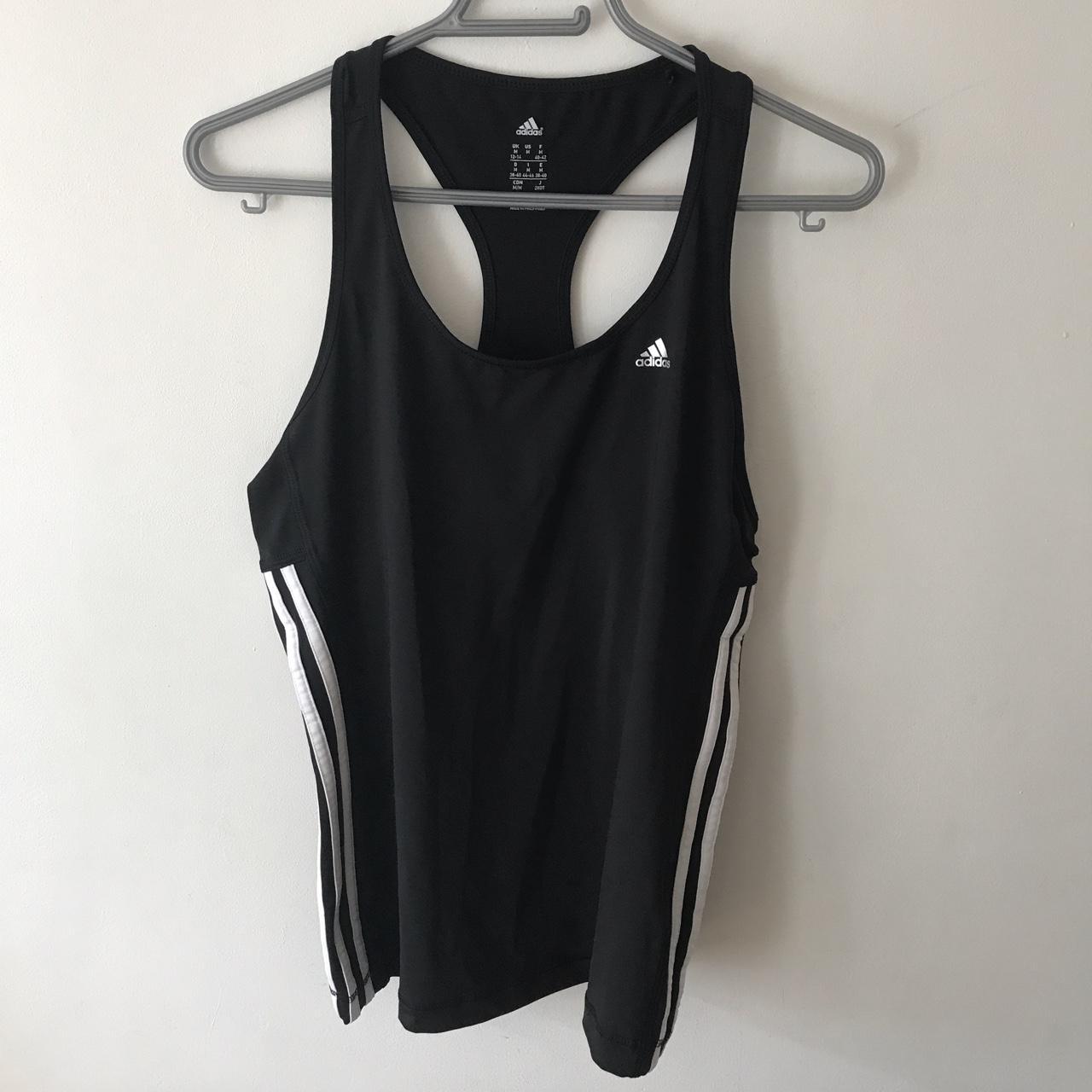 Black Adidas sports top with white stripes down the... - Depop