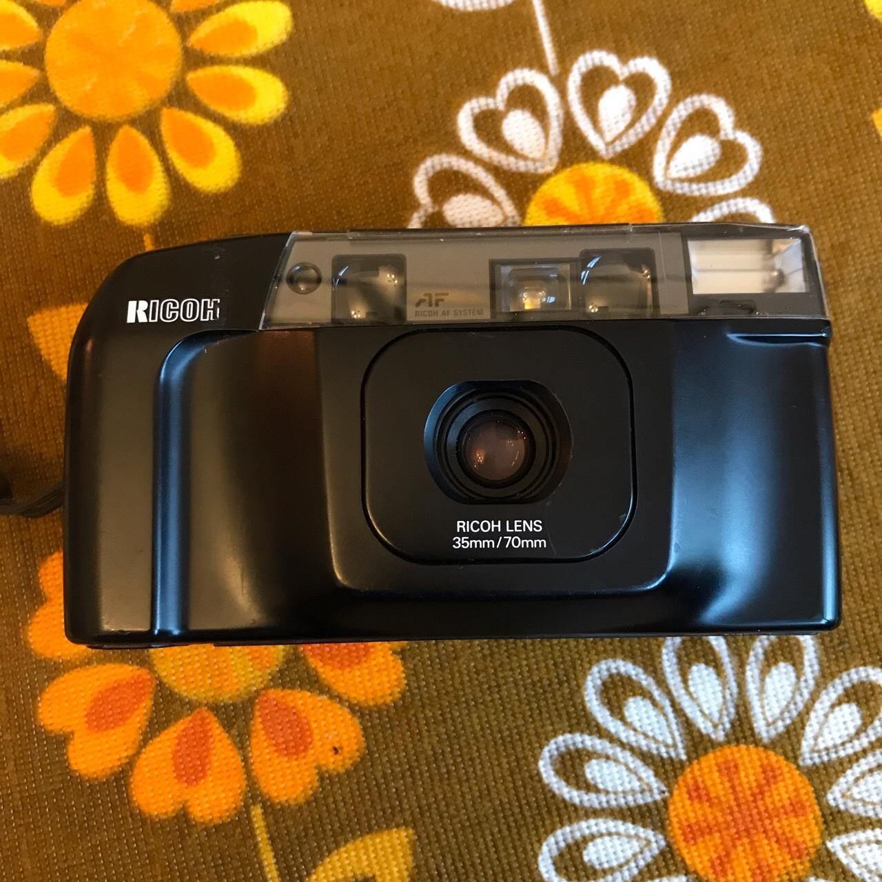 The Ricoh RT-550 Date is a compact 35mm point and... - Depop