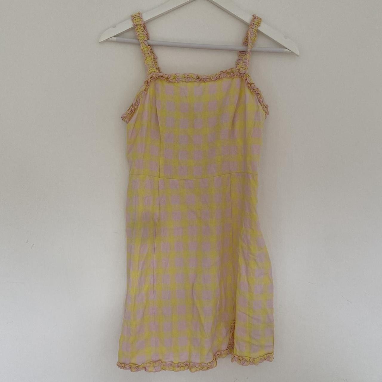 Cute pastel yellow and pink gingham mini dress from... Depop