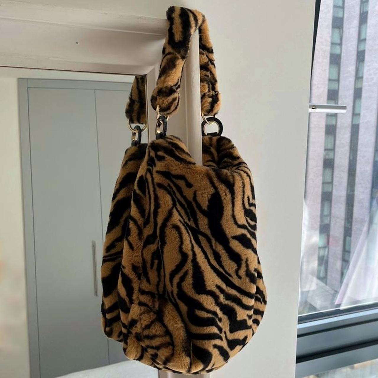 Fern tiger print faux fur shoulder hobo... Depop