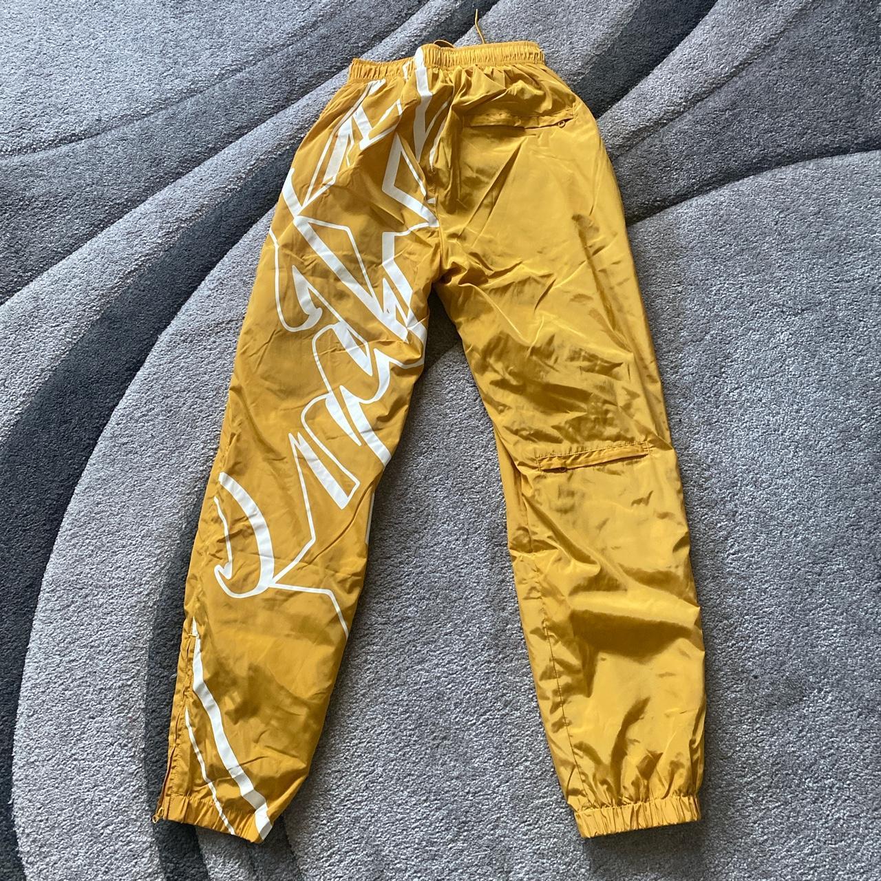 Corteiz yellow nylon track pants (DS) - ordered... - Depop