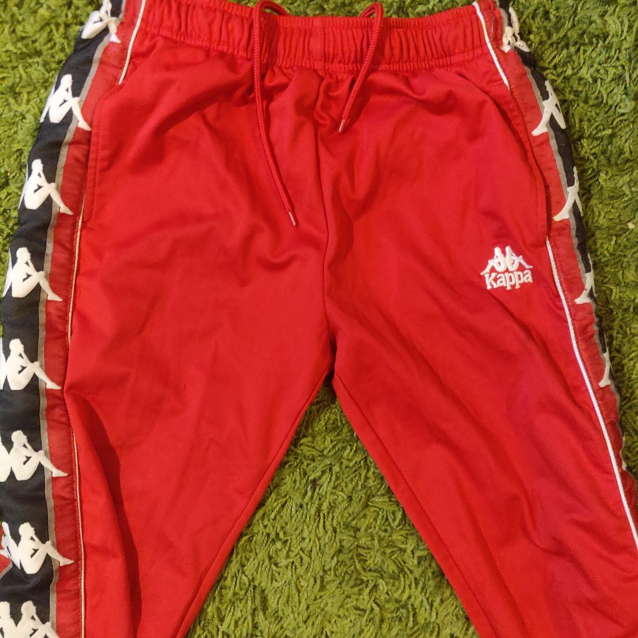 Kappa tracksuit with loads of branding on the legs... Depop