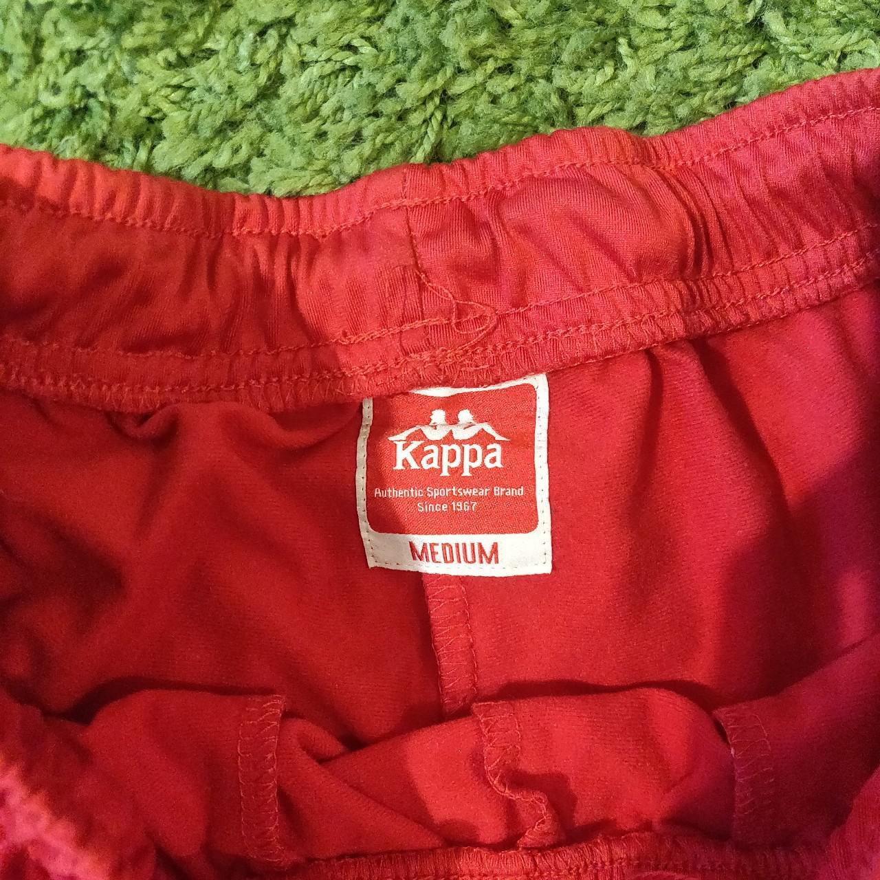 Kappa tracksuit with loads of branding on the legs... Depop