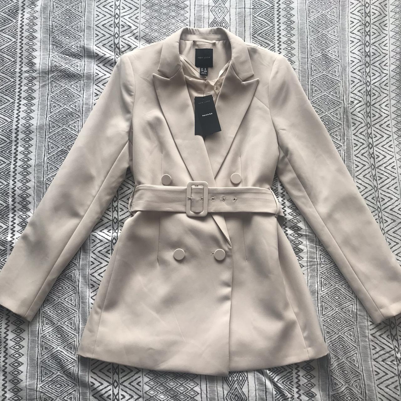 Beige blazer with padded shoulders and belt. Tags... - Depop