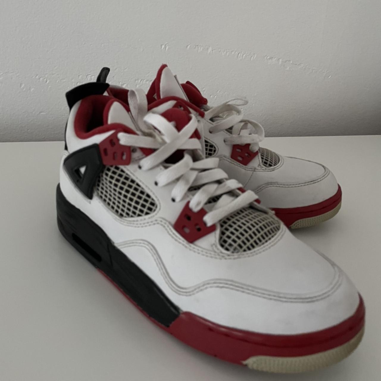 aged jordan 4 fire red