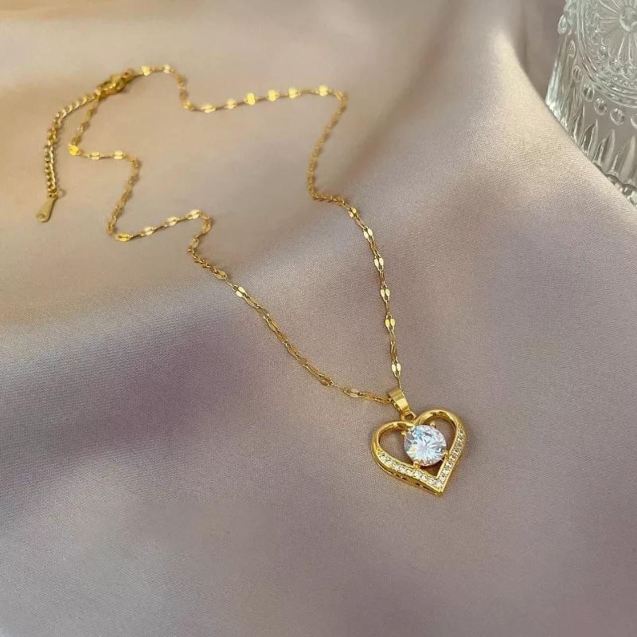 Gold Color heart necklace, made of stainless steel.... - Depop