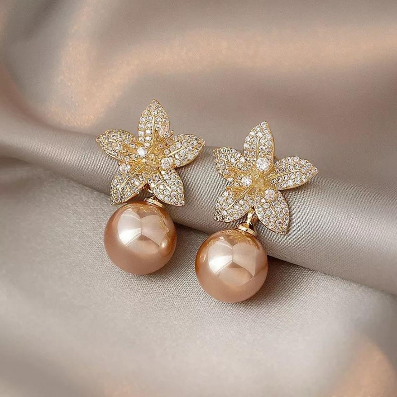 Beautiful flower pearl earrings. Made of zinc alloy.... - Depop