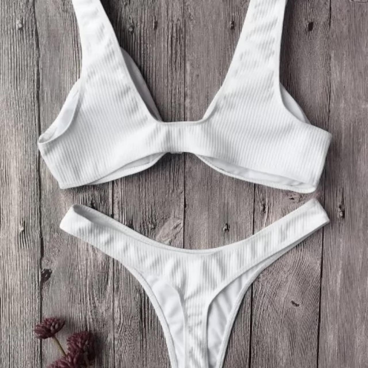 White ribbed bikini with knotted detail on the... - Depop