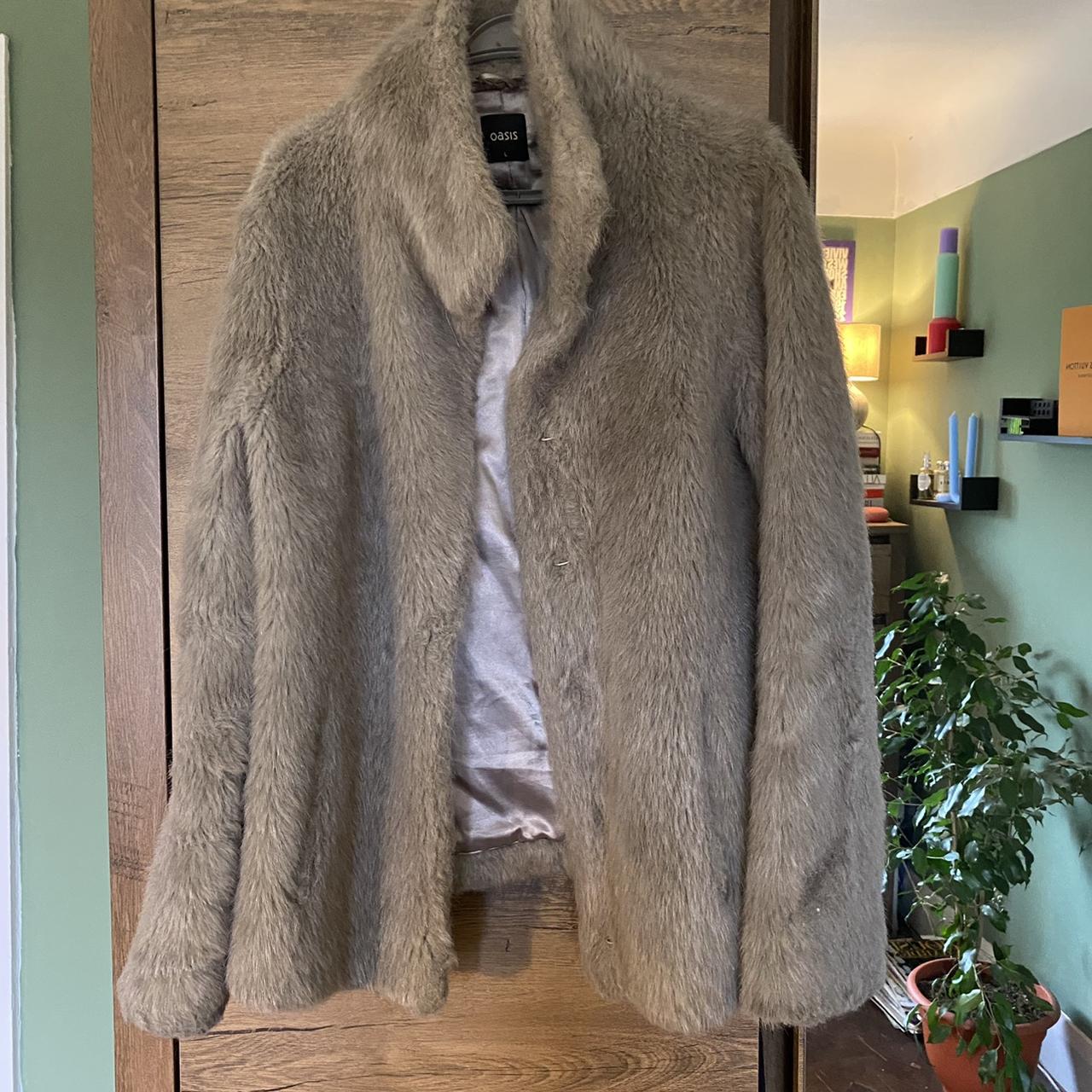 amazing grey faux fur coat, has an option for high… - Depop