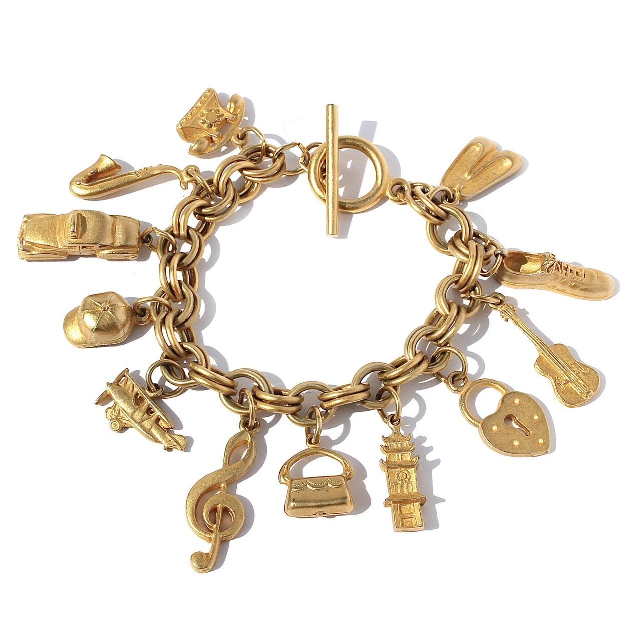 Vintage gold tone charm bracelet. Acquired from a... - Depop