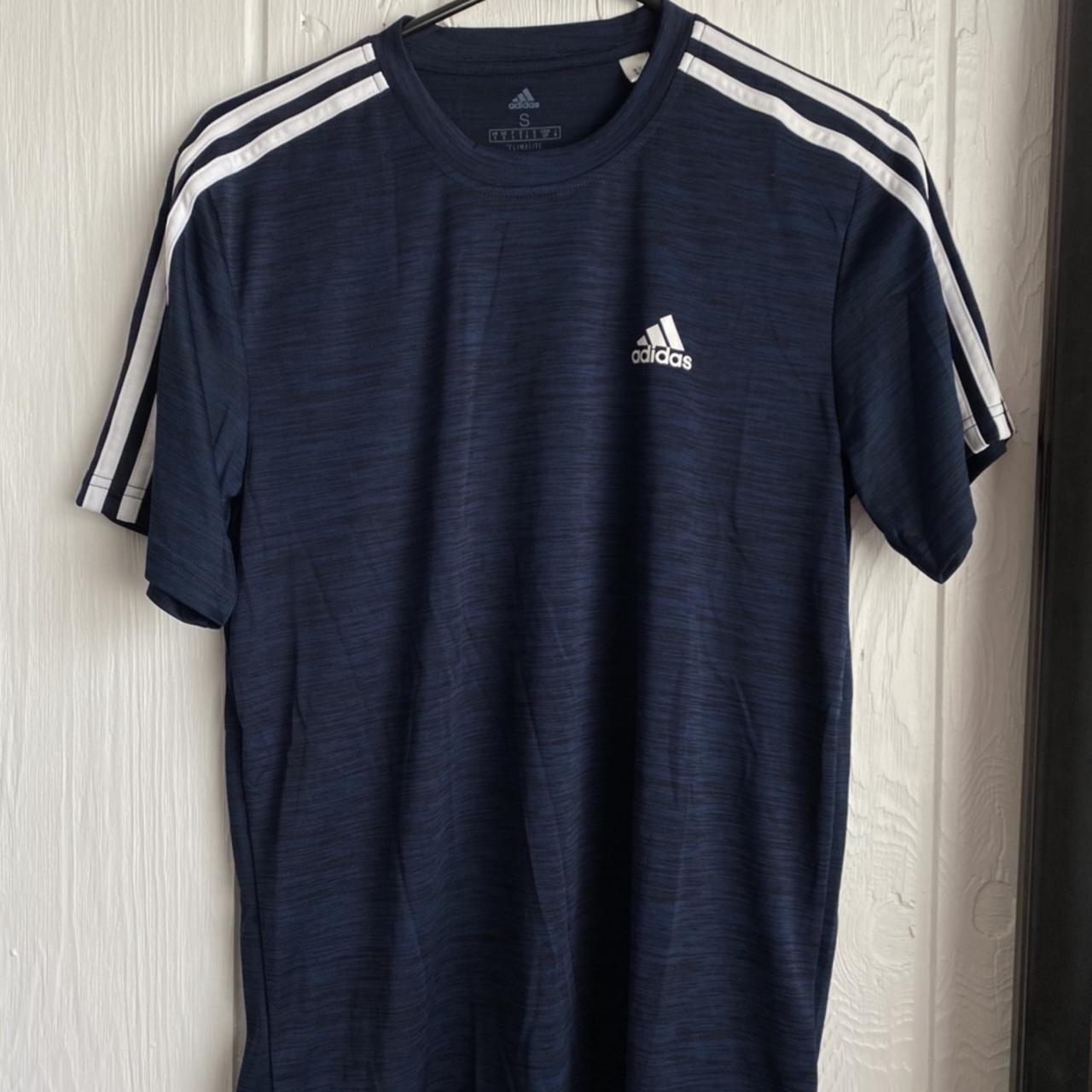 Adidas dry fit // Navy blue with white stripes on... - Depop