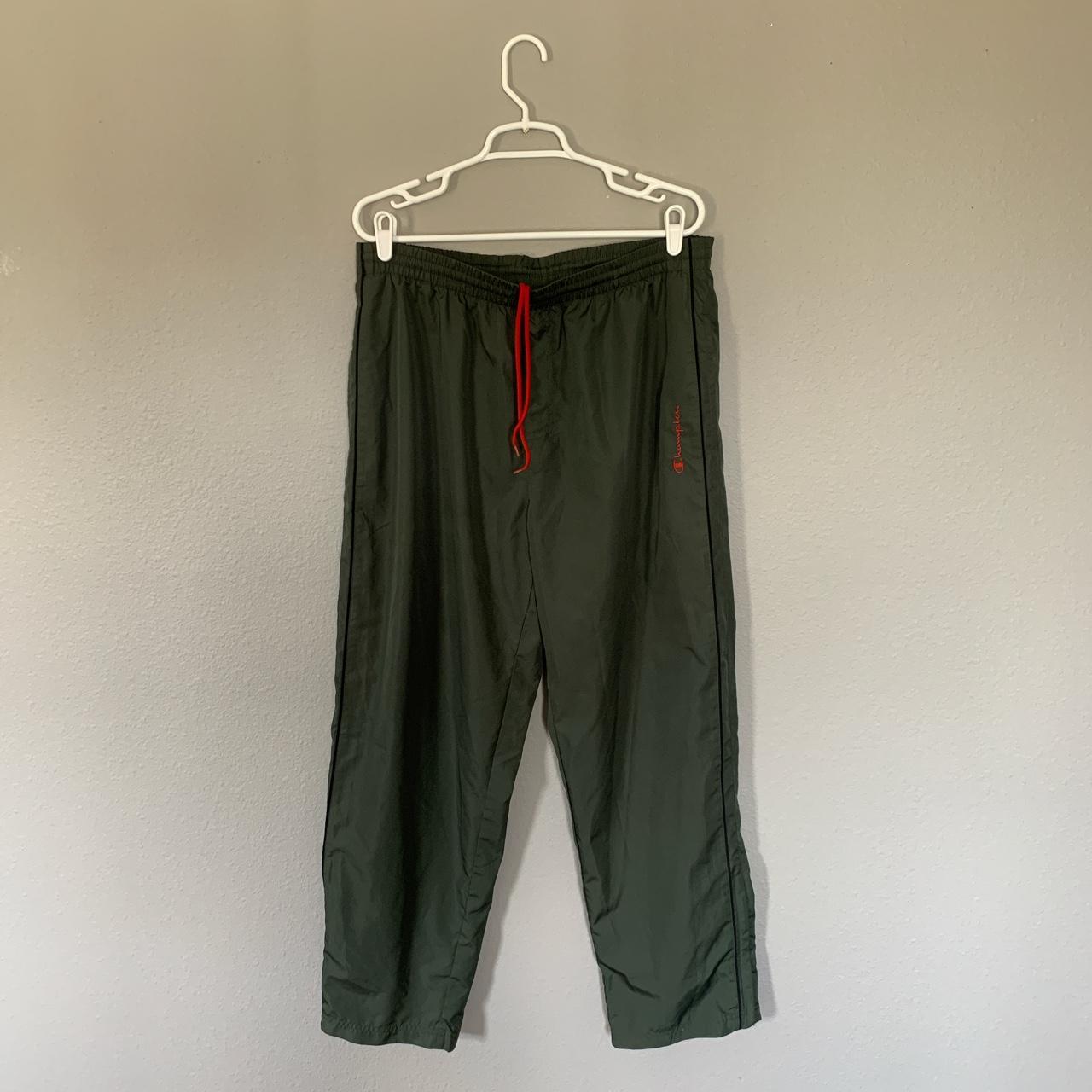 Champion track pants. Olive green color with zippers