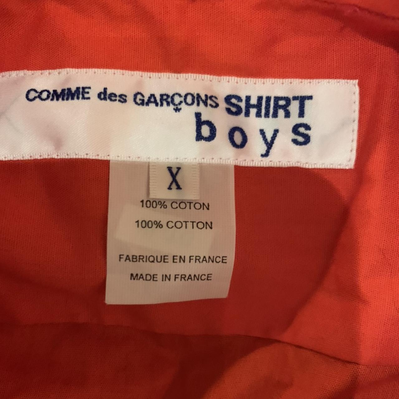 COMME does GAR ON shirt. Bright orange button down