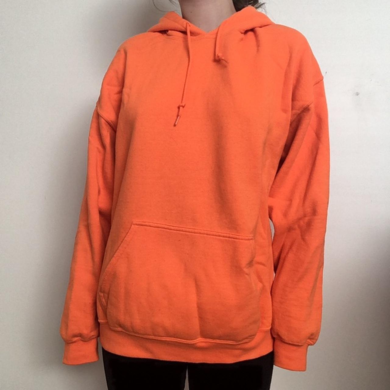 Oversized orange hoodie with I don’t care and rose... - Depop