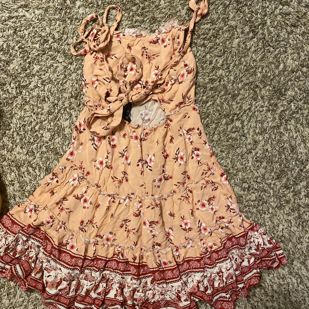 Adorable pink dress no sleeves, it ties into bows... Depop