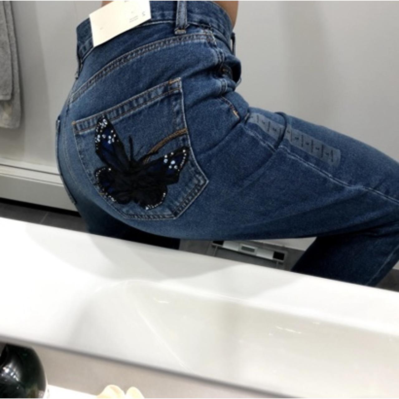 hand-painted mom jeans!, painted a butterfly