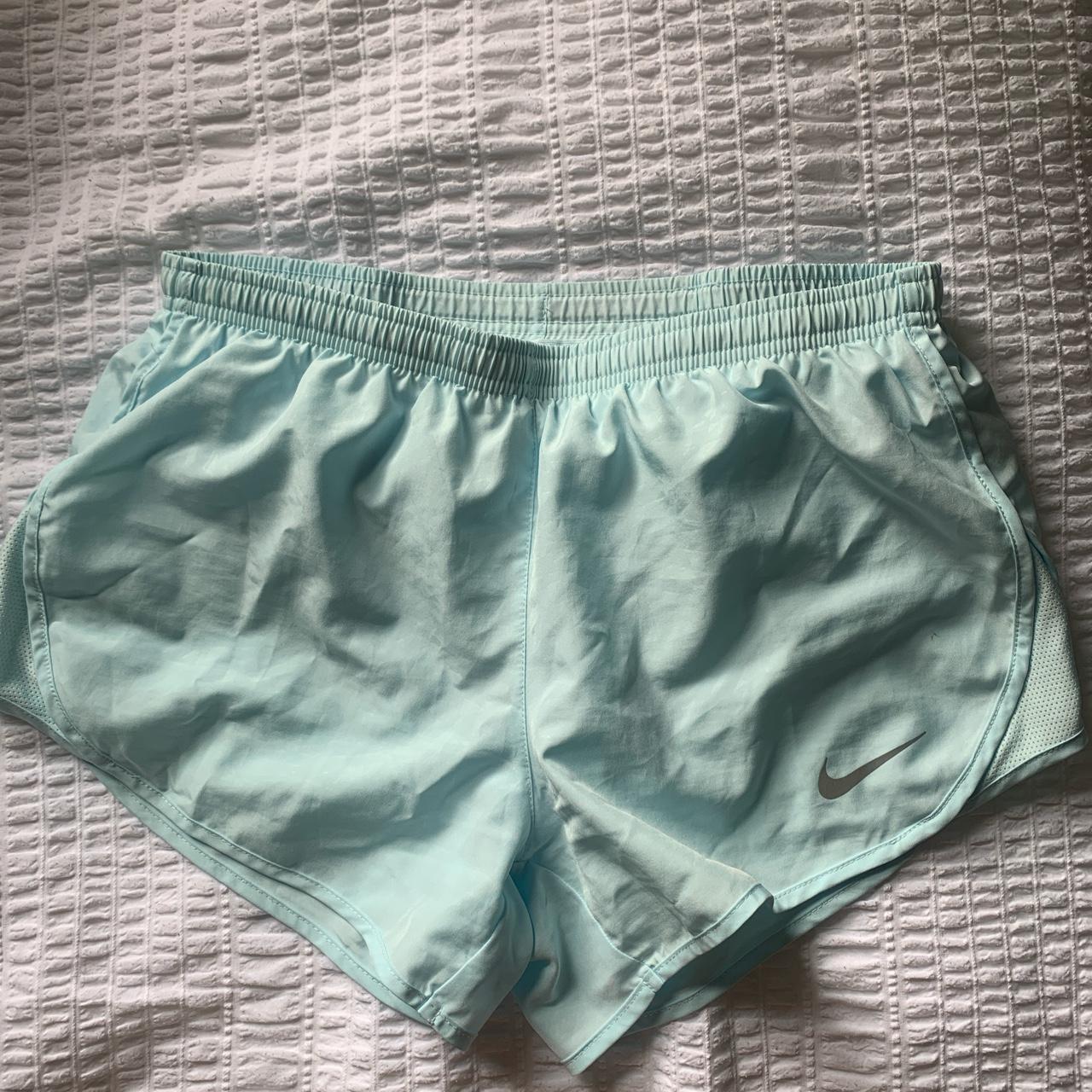 Light blue Nike running shorts with drawstrings.... Depop