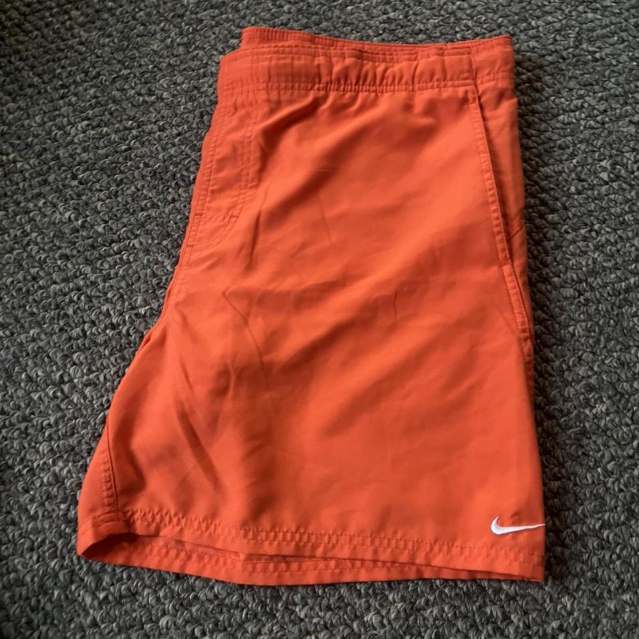 orange nike swim trunks