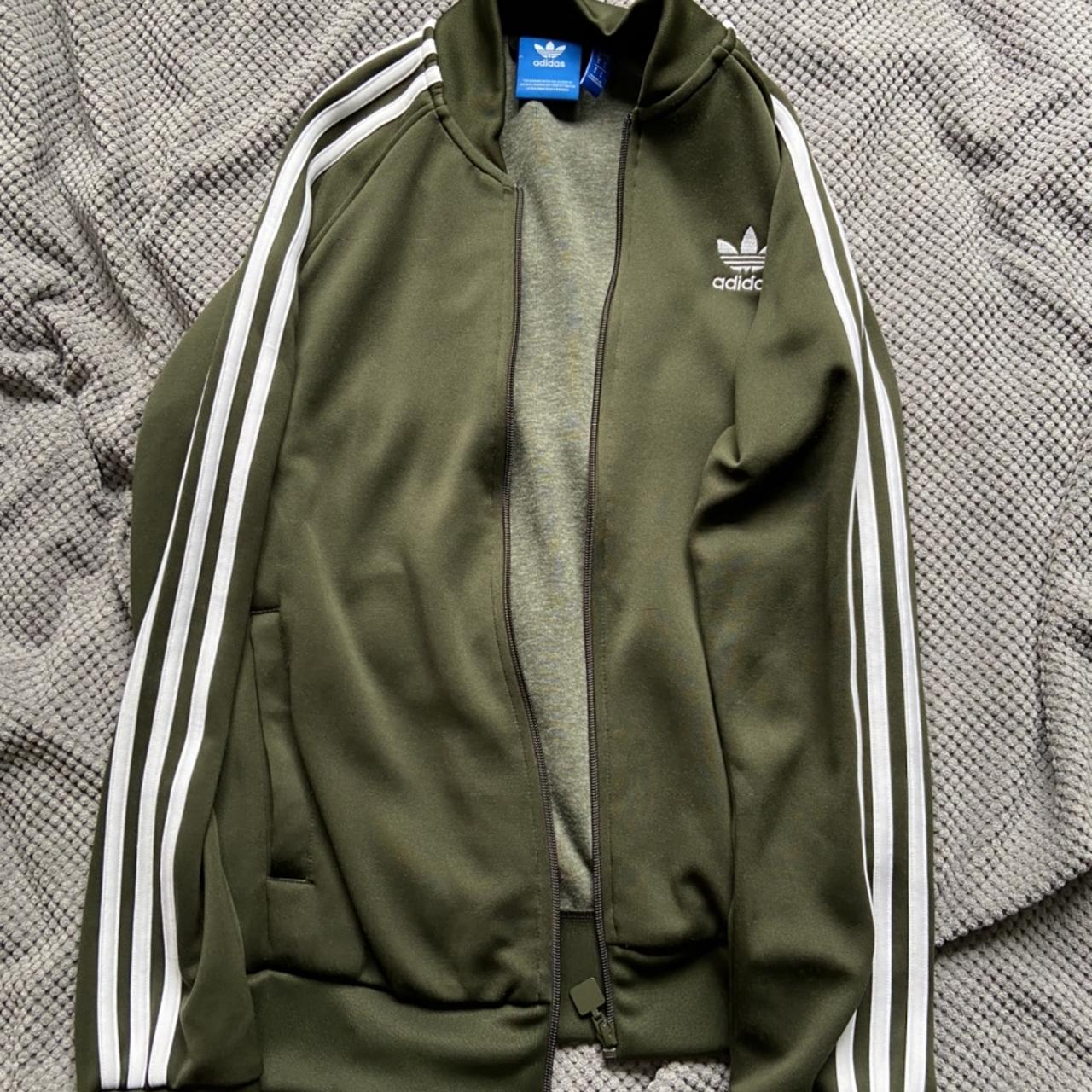 olive green adidas tracksuit top with white stripes... - Depop