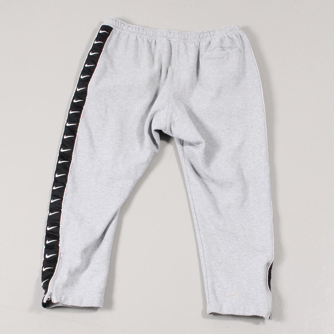 Nike joggers in grey with embroidered swoosh tick... Depop