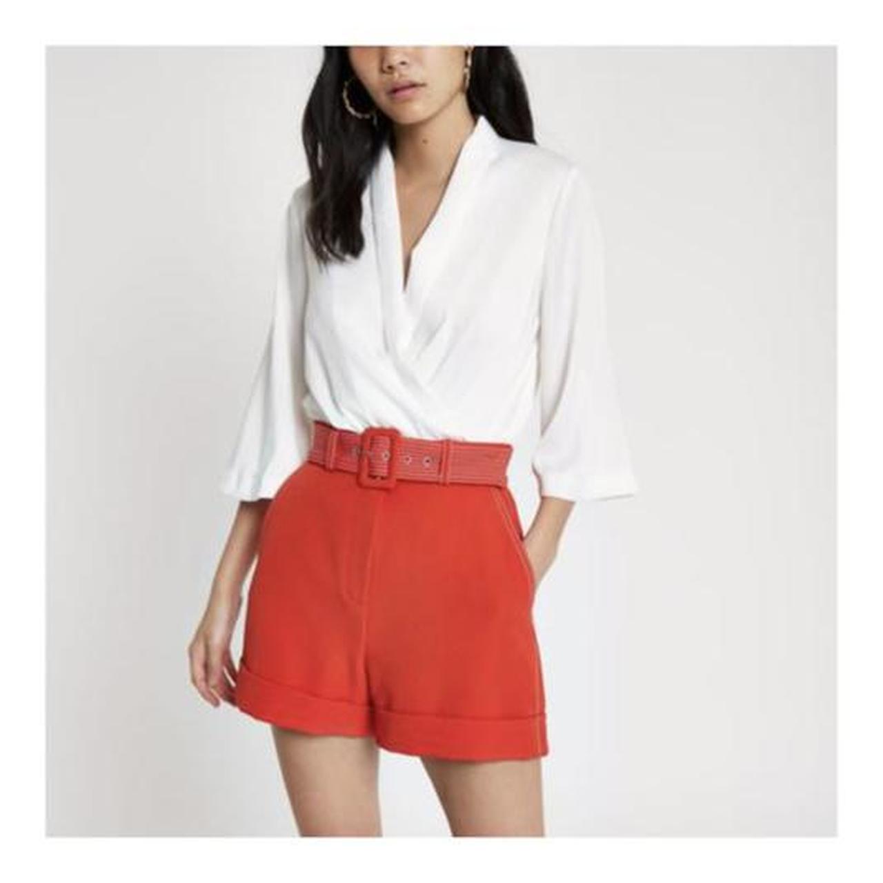 Red store belted shorts