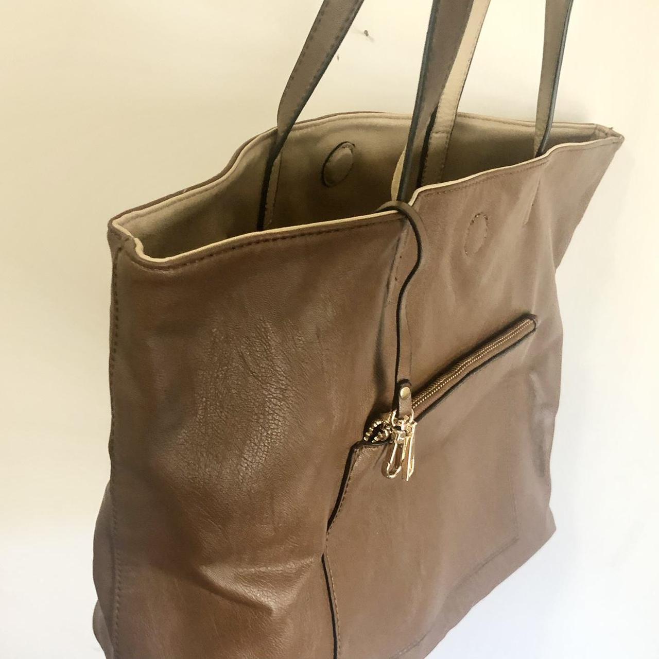 Brown faux leather tote bag featuring gold hardware... - Depop