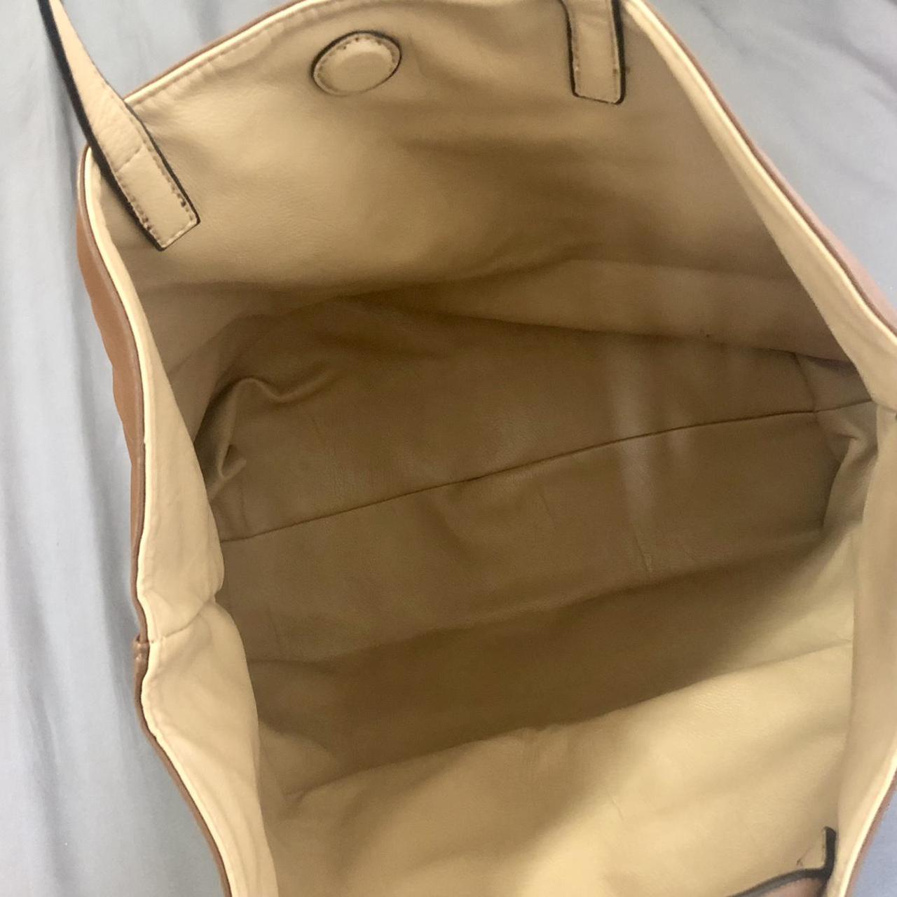 Brown faux leather tote bag featuring gold hardware... - Depop