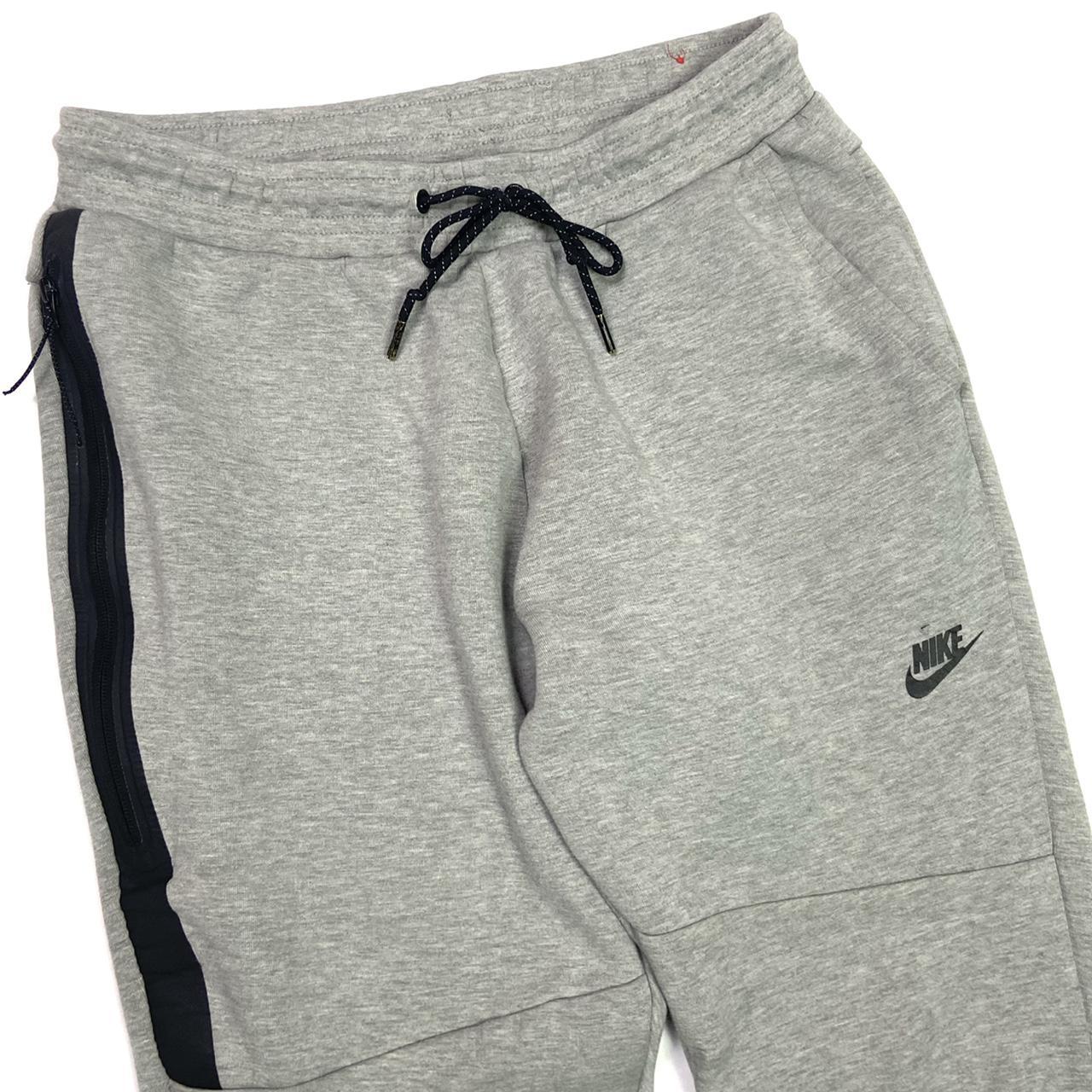 Nike tech fleece heather grey and black joggers... Depop